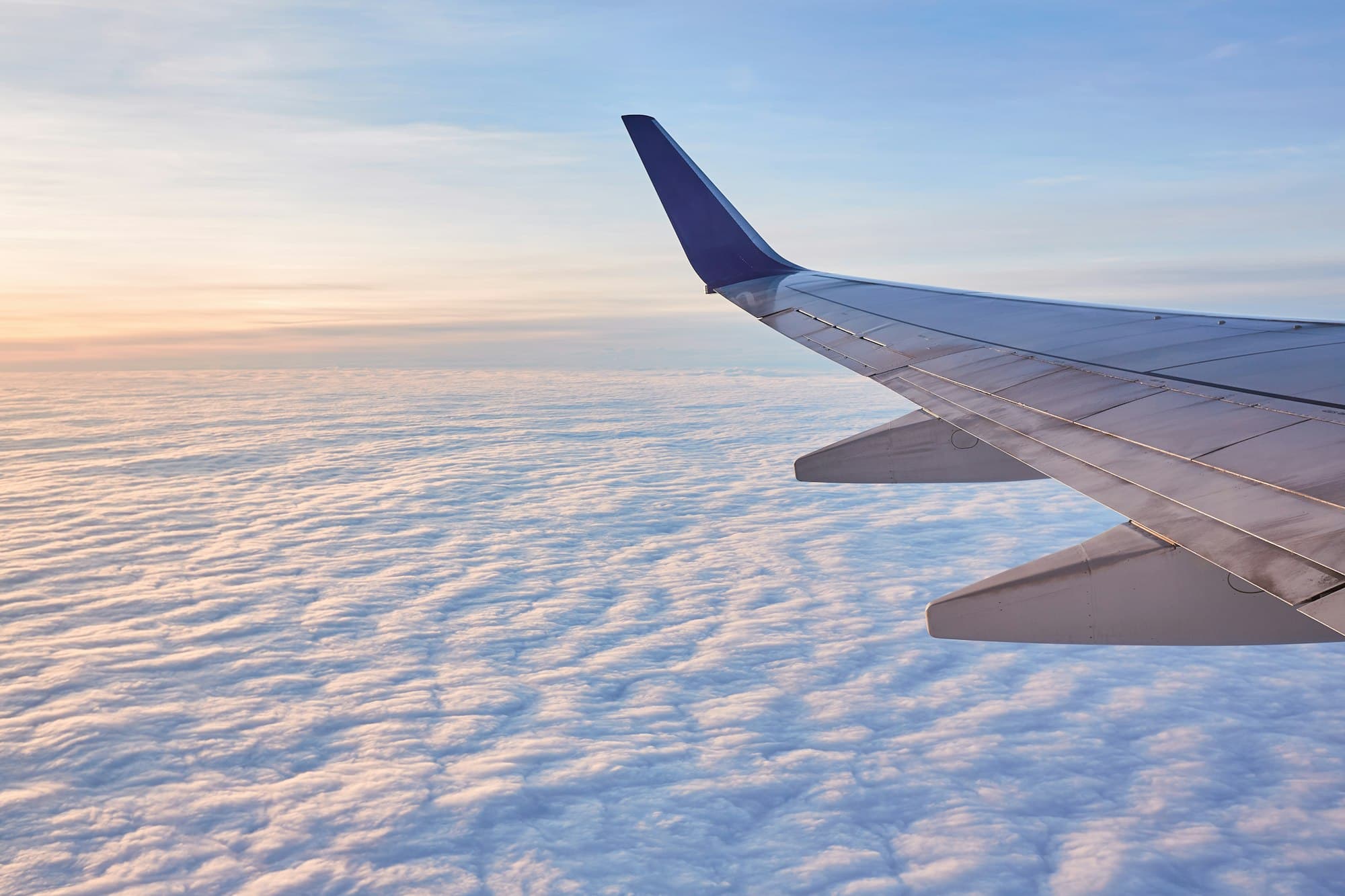 Aircraft wing above the clouds